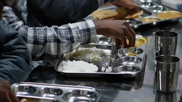 Stainless steel buffet counter with freshly prepared curries