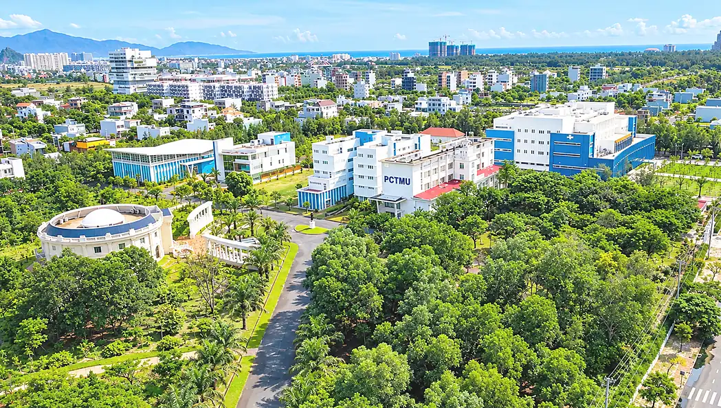 Aerial overview of Phan Chau Trinh University campus and coastal grounds in Da Nang